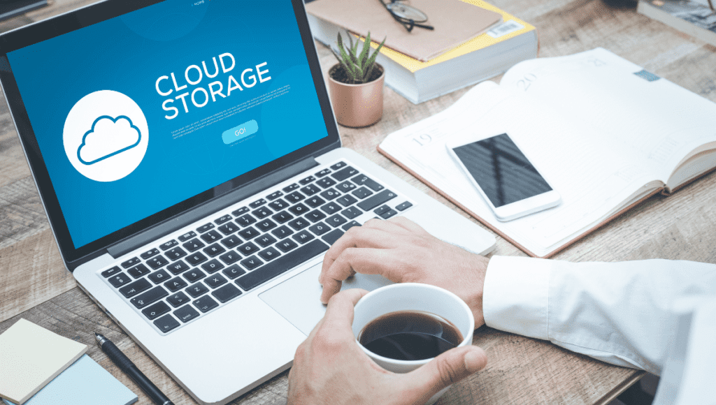 A small business owner is utilizing a laptop with cloud storage for their data management.